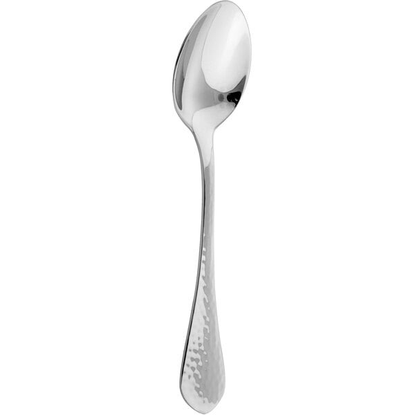 An Arcoroc stainless steel dessert spoon with a handle and a spoon bowl.