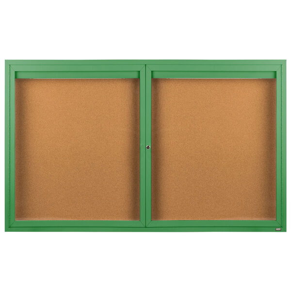 A green framed Aarco indoor enclosed bulletin board with two doors.