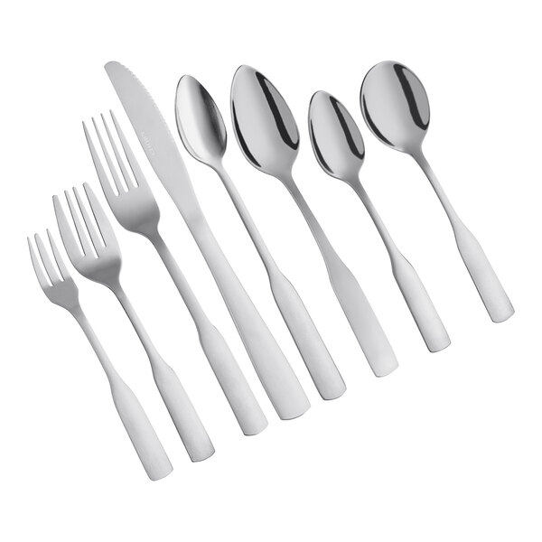 A group of Choice Bellwood stainless steel salad forks.