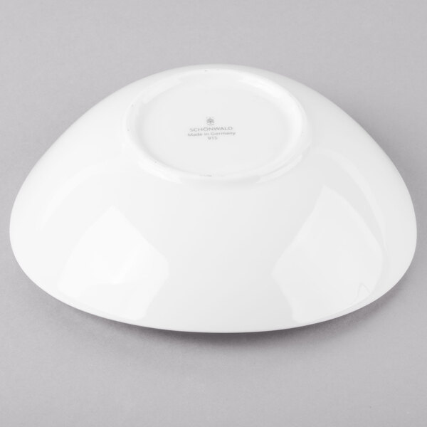 A white Schonwald Grace porcelain bowl on a gray surface.