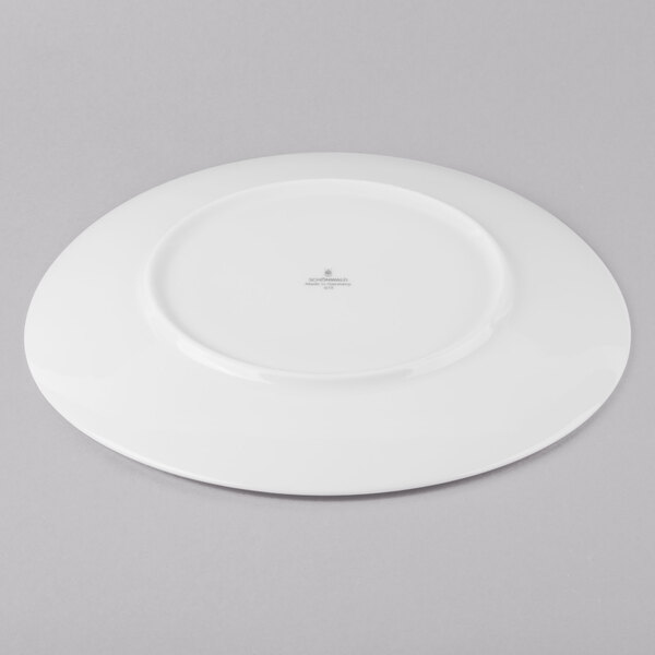 A Schonwald Grace white porcelain plate with a small hole in the middle.