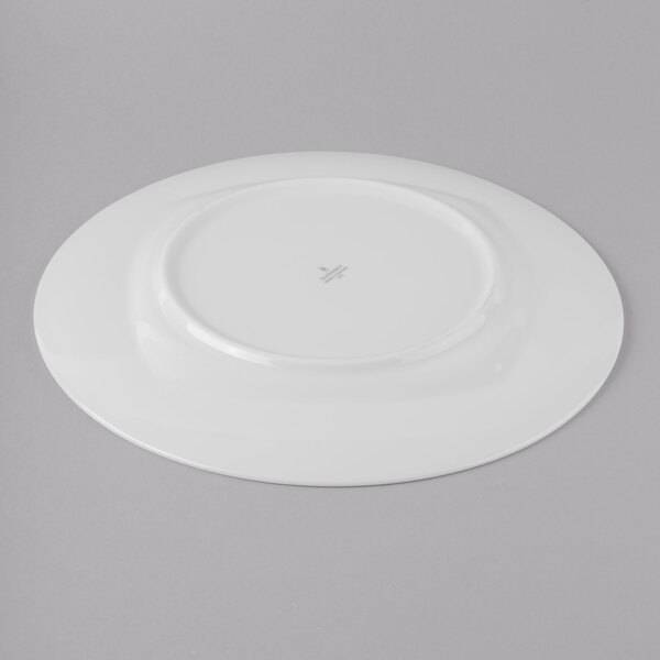 A white Schonwald porcelain plate with a circular design on it.