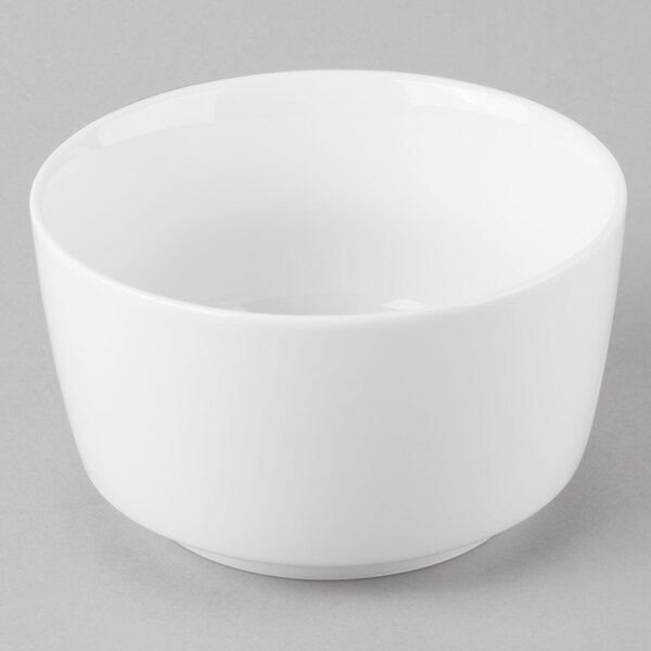 A white Schonwald jam jar on a gray surface.