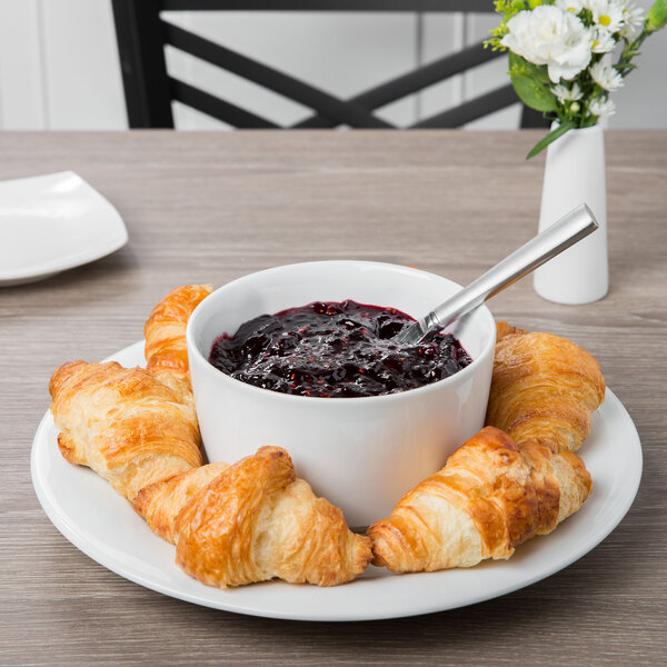 A Schonwald Continental White jam jar on a plate with a bowl of blueberry jam and croissants.