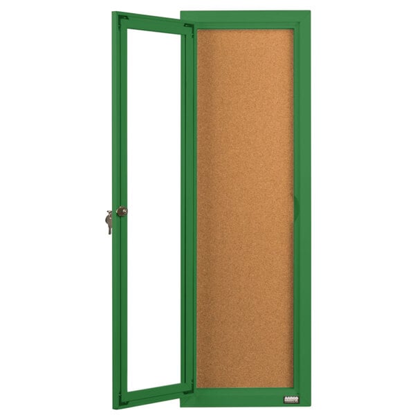 A green enclosed bulletin board cabinet with a cork board and a green door with a keyhole.