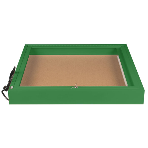 A green rectangular Aarco bulletin board cabinet with a key on the door.