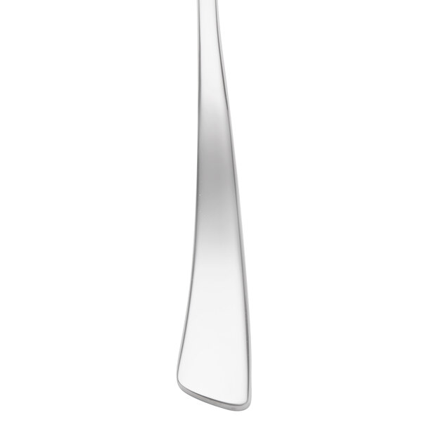 A close-up of a Chef & Sommelier stainless steel oyster fork.