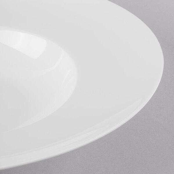A Schonwald Grace white porcelain pasta bowl with a rim.