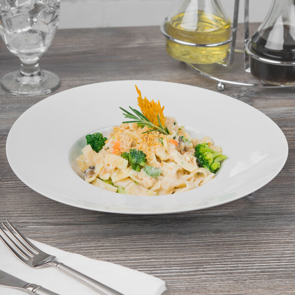 A Schonwald Grace white porcelain pasta bowl filled with pasta, broccoli, and cheese.