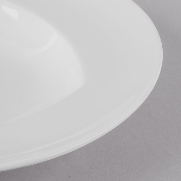 A close up of a Schonwald Continental White Rim deep porcelain bowl on a white surface.