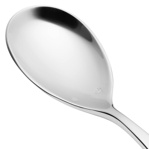 A close-up of a Chef & Sommelier stainless steel dessert spoon with a silver handle.