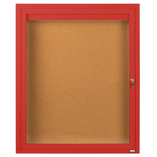 An Aarco red enclosed bulletin board with a glass door.