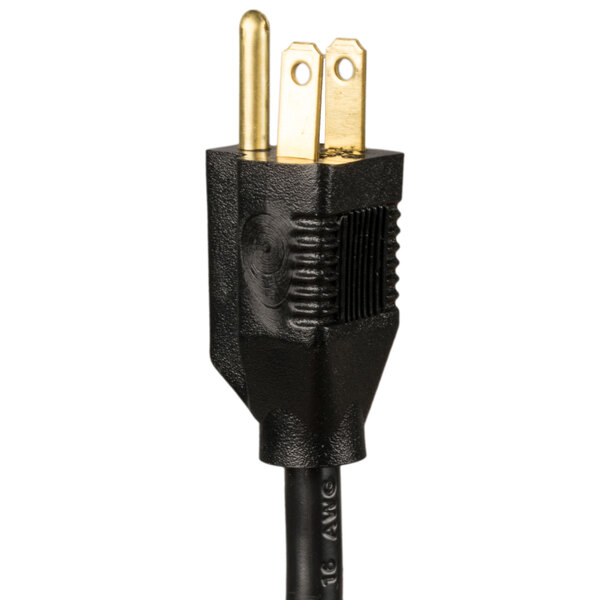 The black power cord with a gold plug on the end of a red Aarco bulletin board cabinet.
