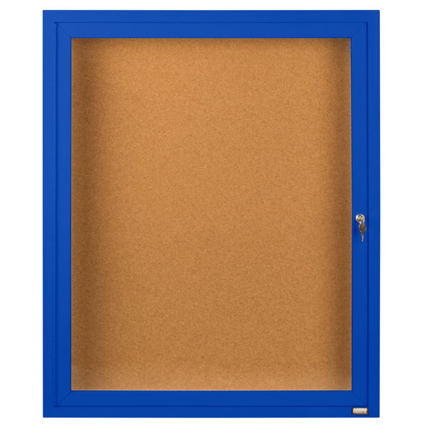 A blue and white rectangular Aarco bulletin board cabinet with a hinged door.