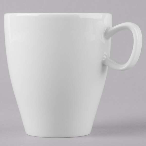 A Schonwald white porcelain cup with a handle.
