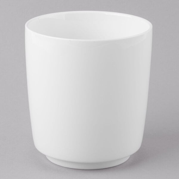 A Schonwald white dressing pot with a lid on a gray background.