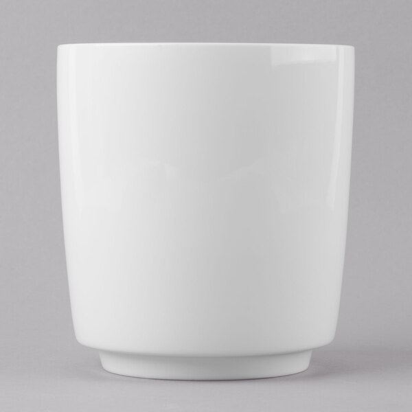 A Schonwald white dressing pot with a lid on a white surface.