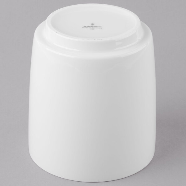 A Schonwald white dressing pot with a lid.