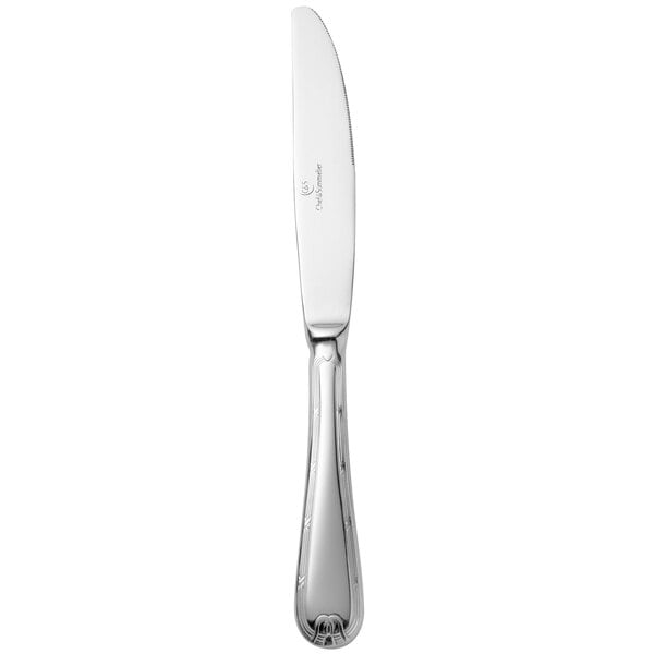 A silver Chef & Sommelier stainless steel dinner knife with a white handle.