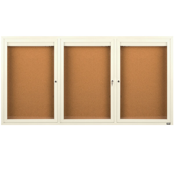 A white cabinet with three glass doors.