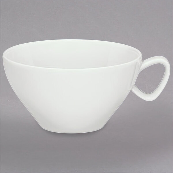 A white Schonwald porcelain cup with a handle.