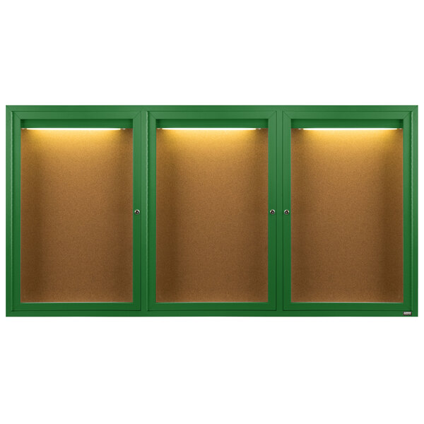 An Aarco green enclosed bulletin board cabinet with lights.