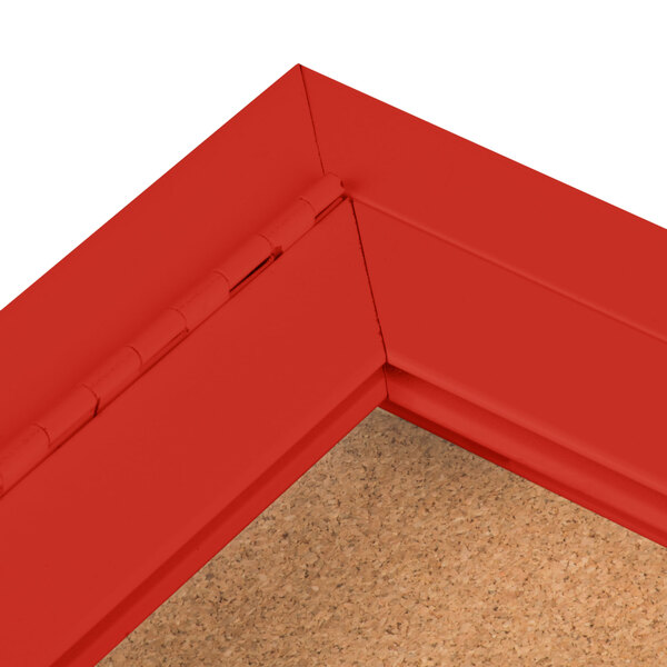 A red Aarco bulletin board cabinet with a cork interior.