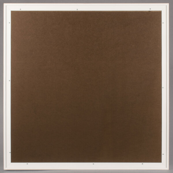A brown square bulletin board with a white frame.