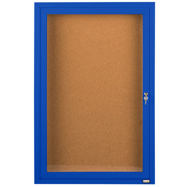 A blue Aarco bulletin board cabinet with a clear door and a key.