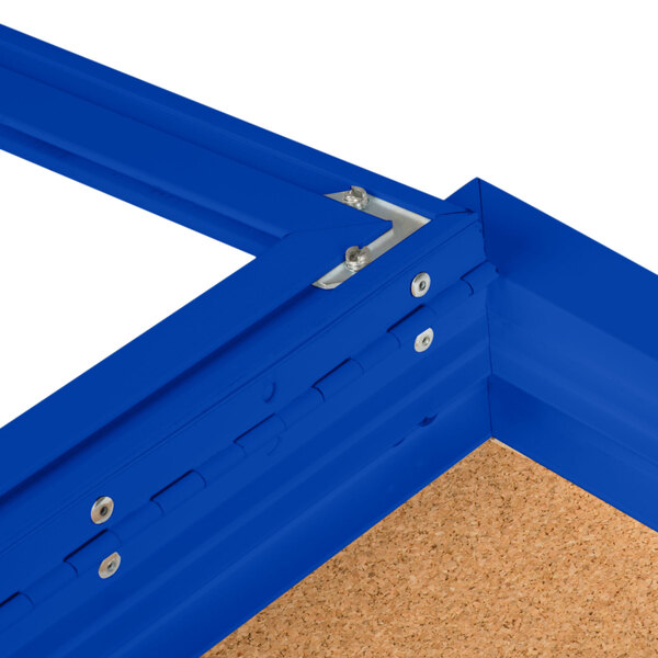 A blue Aarco bulletin board cabinet frame with metal clips and cork inside.