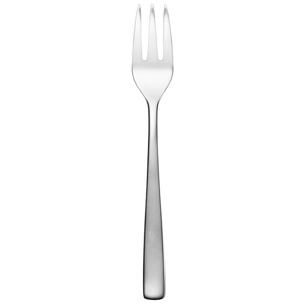 An Arcoroc stainless steel oyster fork with a white background.