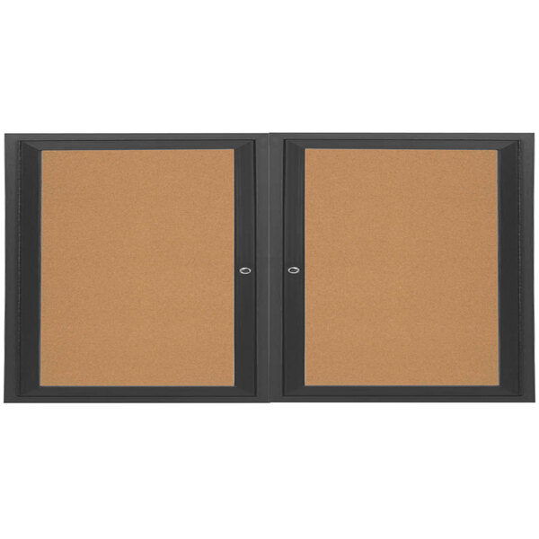 A black Aarco enclosed bulletin board cabinet with 2 doors.