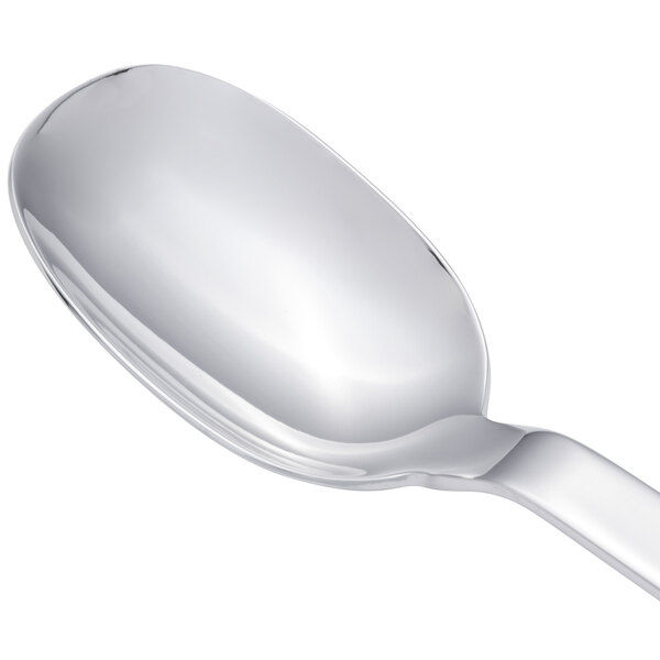 An Arcoroc stainless steel dessert spoon with a silver handle.