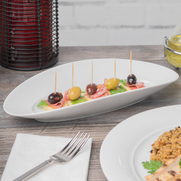 A Schonwald Grace long tray with food on a table in an Italian restaurant.