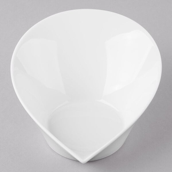 A Schonwald white porcelain bowl with a curved shape.