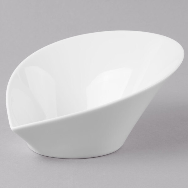 A white Schonwald porcelain bowl with a small hole in the middle.