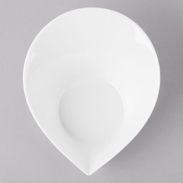 A Schonwald white porcelain bowl with a small hole in it.