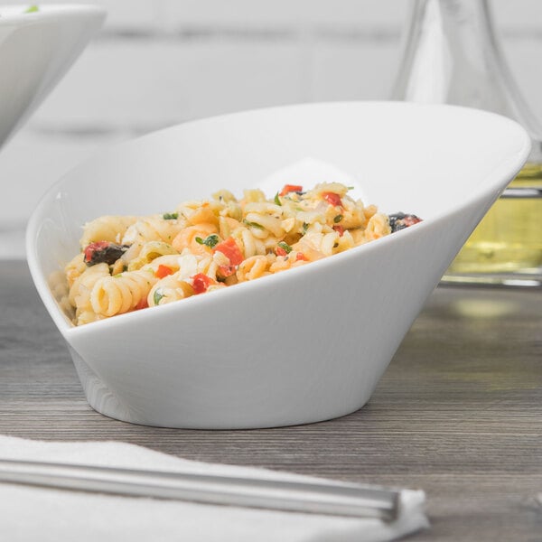A close-up of a Schonwald Grace white porcelain bowl filled with pasta.