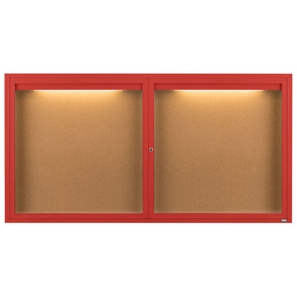 Two red Aarco enclosed bulletin boards with lights.