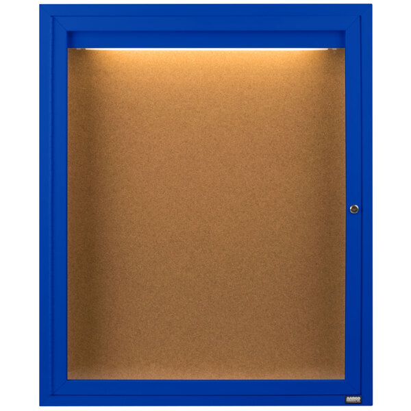 A blue rectangular bulletin board cabinet with a light on top.