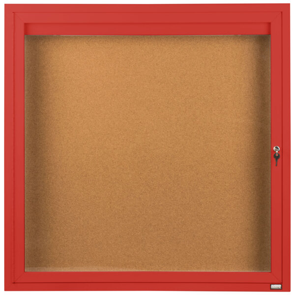A red Aarco enclosed bulletin board with a glass door.