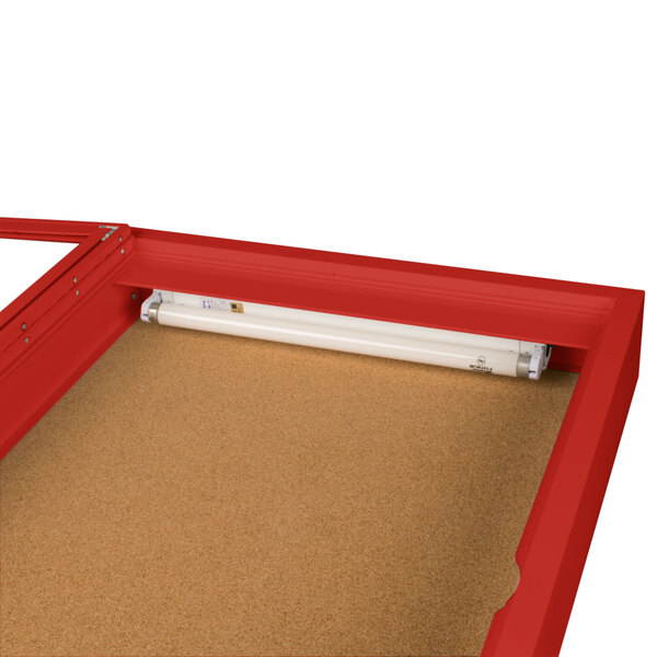 A red rectangular Aarco bulletin board cabinet with a white light inside.