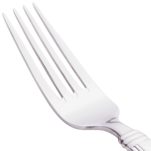 A Libbey stainless steel dinner fork with a silver handle.
