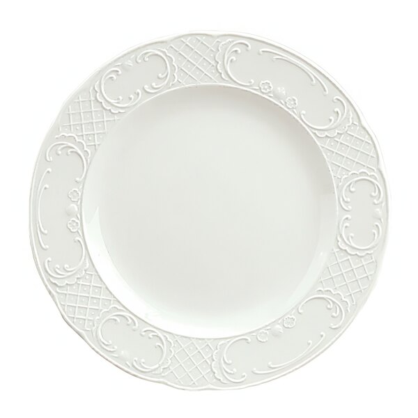 A close up of a Schonwald white porcelain plate with a pattern.