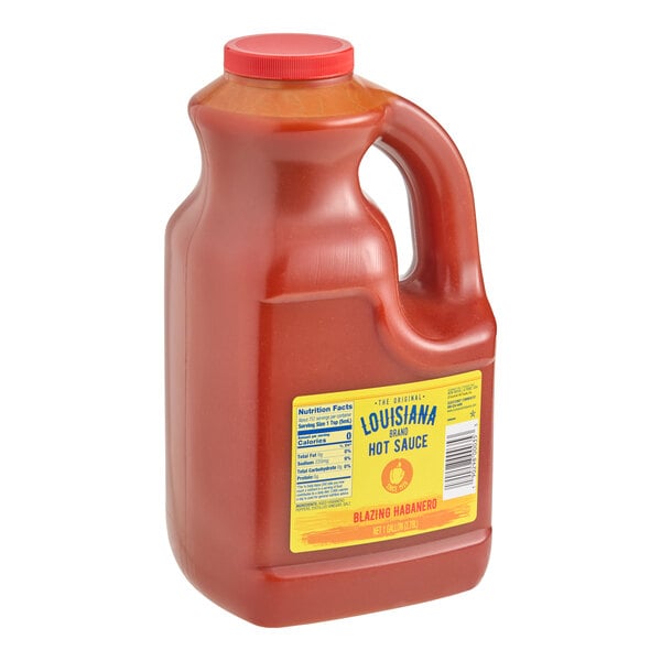 A 1-gallon jug of Louisiana brand Blazing Habanero hot sauce.