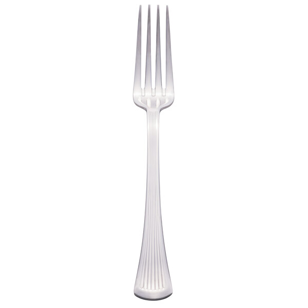 A Libbey stainless steel European dinner fork with a white handle.