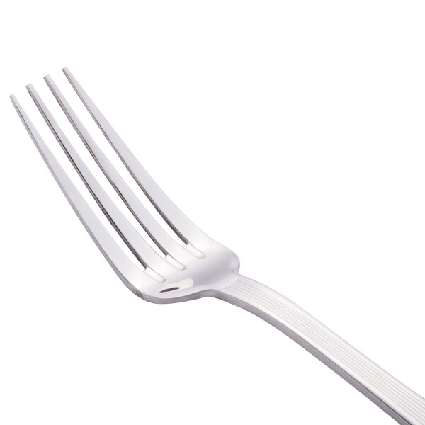 A close-up of a Libbey stainless steel dinner fork with a silver handle.