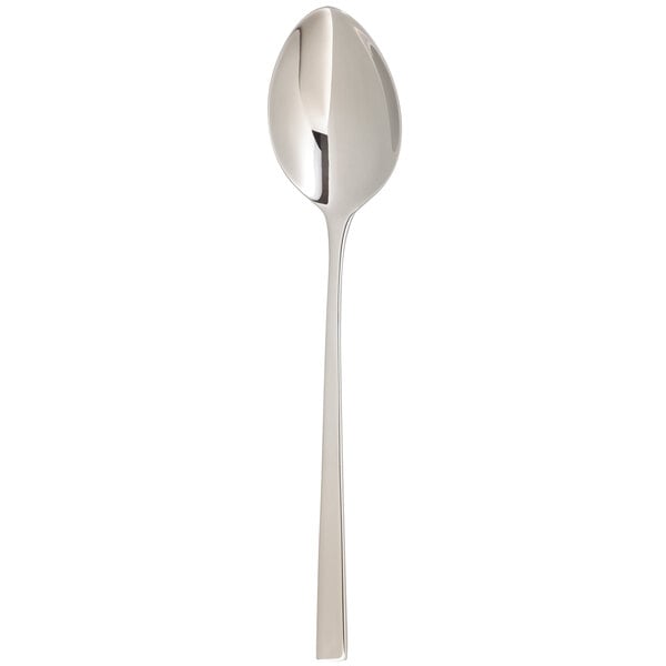 An Arcoroc stainless steel dinner spoon with a long handle.