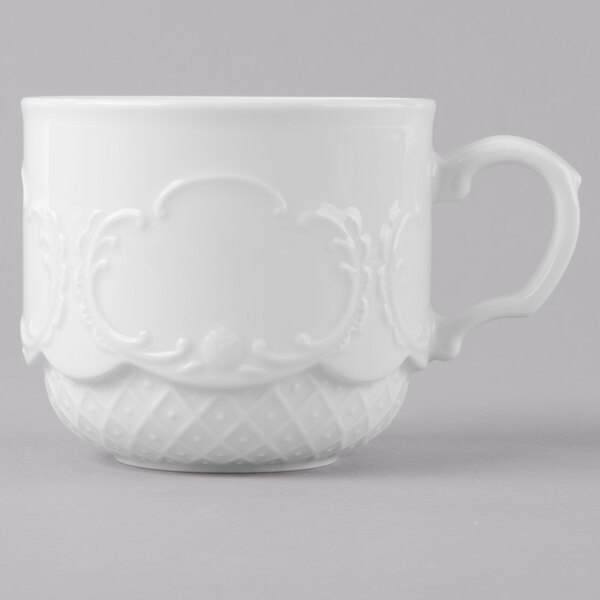 A Schonwald white porcelain cup with a handle.