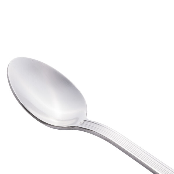 A close-up of a Libbey stainless steel iced tea spoon with a silver handle.